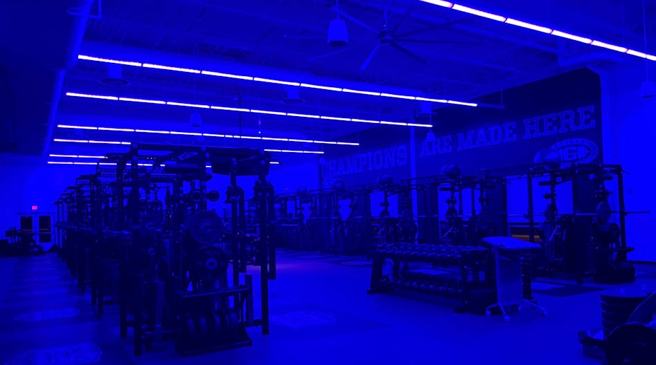 Indigo-Clean technology in use at Chelsea High School&apos;s weight room, in Michigan. Exercise facilities have been considered high-risk for transmission of harmful bacteria because of their enclosed environment, shared equipment, and close contact between users and staff. Clinically proven to reduce harmful bacteria, 405-nanometer lighting technology can be installed to provide continuous disinfection.