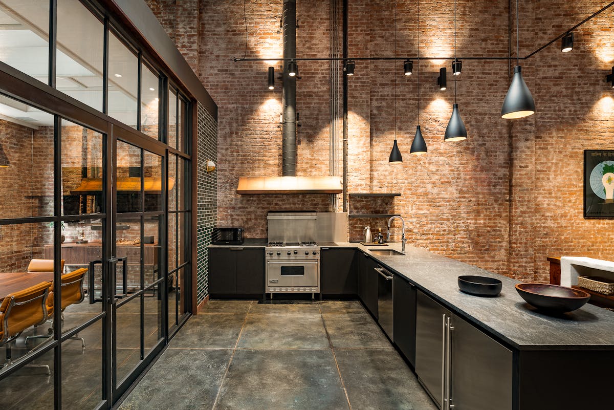 The open kitchen features Swell pendants from Pablo Design.