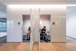 Private phone rooms have lamps and wallpaper that are unique to each floor; these booths on the fourth floor feature IC floor lamps from Flos.