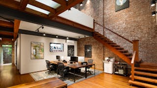 A historic townhouse is converted into an office environment with hints of residential design.