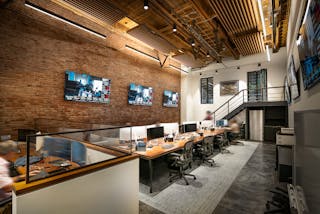 The first-floor office uses Amerlux track lighting and suspended linear fixtures from Lumenera Lighting, available from Buhl LED.