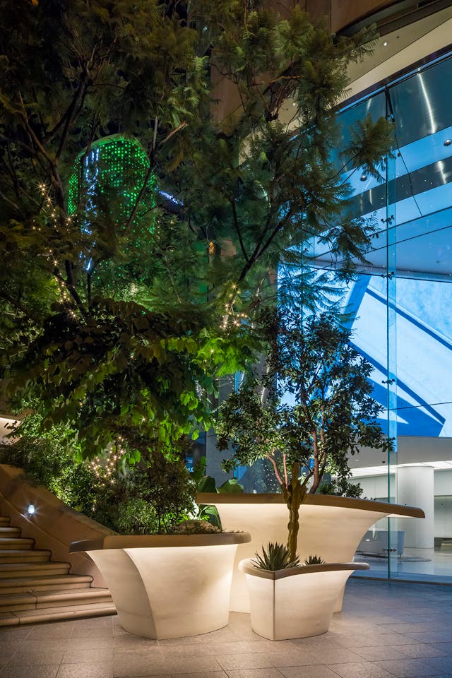 Bunker Hill Steps, Los Angeles. Concealed linear LED lighting follows the contours of complex curved planter forms, creating an approachable, human-scaled lighting design along a busy street.