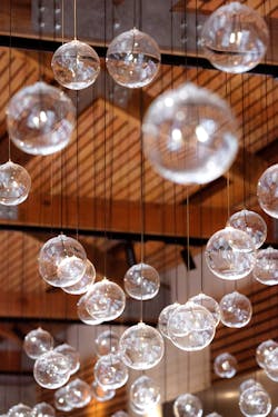 Ad Gefrin&apos;s Bistro features 270 spherical glass pendants illuminated with internal fiber optics and arranged by hand.
