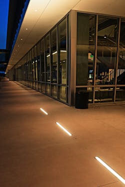 Targetti&rsquo;s Jedi Recessed linear in-grade luminaires end where the cantilever meets the building columns.