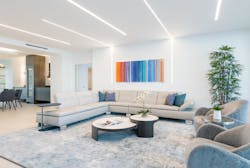 For this contemporary living room, Light Up Your Life specified PureEdge Lighting&apos;s TruLine, which aligns with the artwork and seating areas.