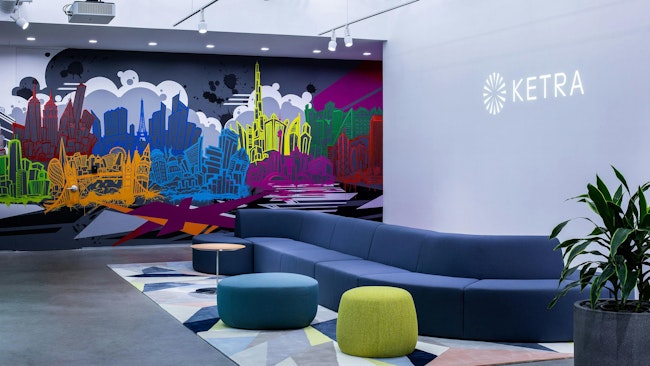 A mural by hometown artist Aaron Darling at Ketra’s headquarters in Austin depicts skylines across the world where Lutron has offices.