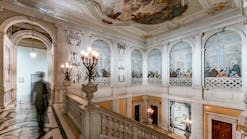 At Palazzo Grassi, low-profile spotlights illuminate the grand marble staircase with original frescos.