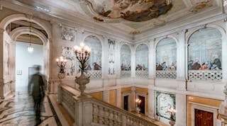 At Palazzo Grassi, low-profile spotlights illuminate the grand marble staircase with original frescos.