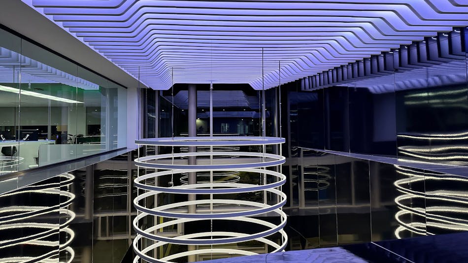 The DIMM-shaped ceiling-mounted sculpture includes LED lights and custom linear baffles.