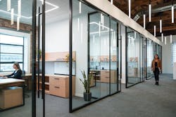The perimeter offices and conference room are separated from the open workspace by 10-foot-tall glass partitions that allow ample daylighting.